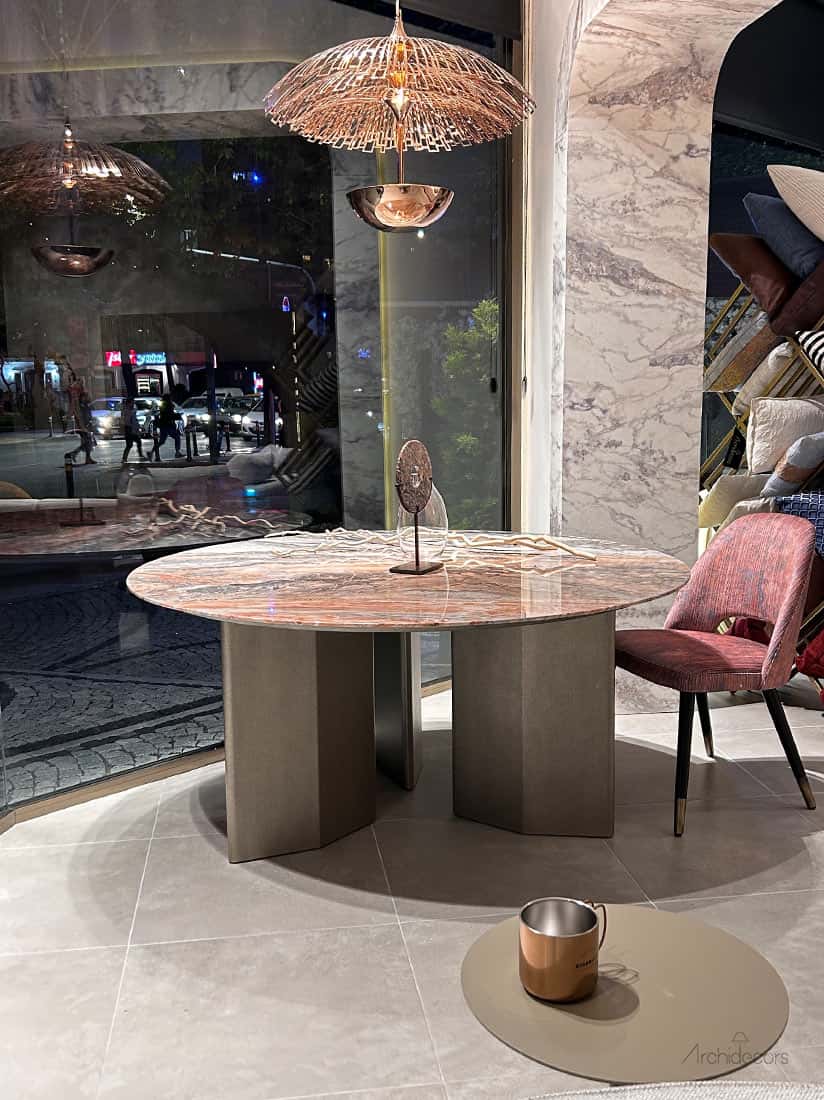 Another view of the Merce Round Marble Table dining table, made to order by Archidecors